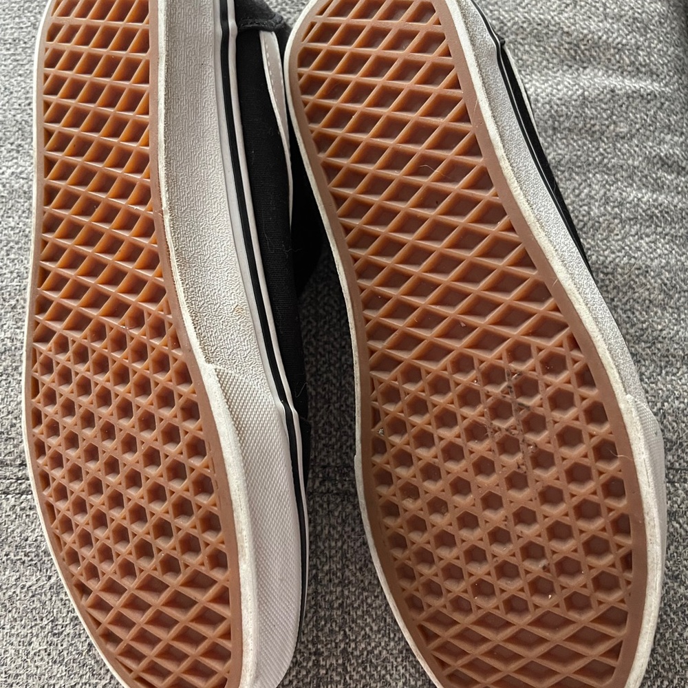 Vans, black canvas with white stripe. Missing laces. Size 9 women’s- barely used
